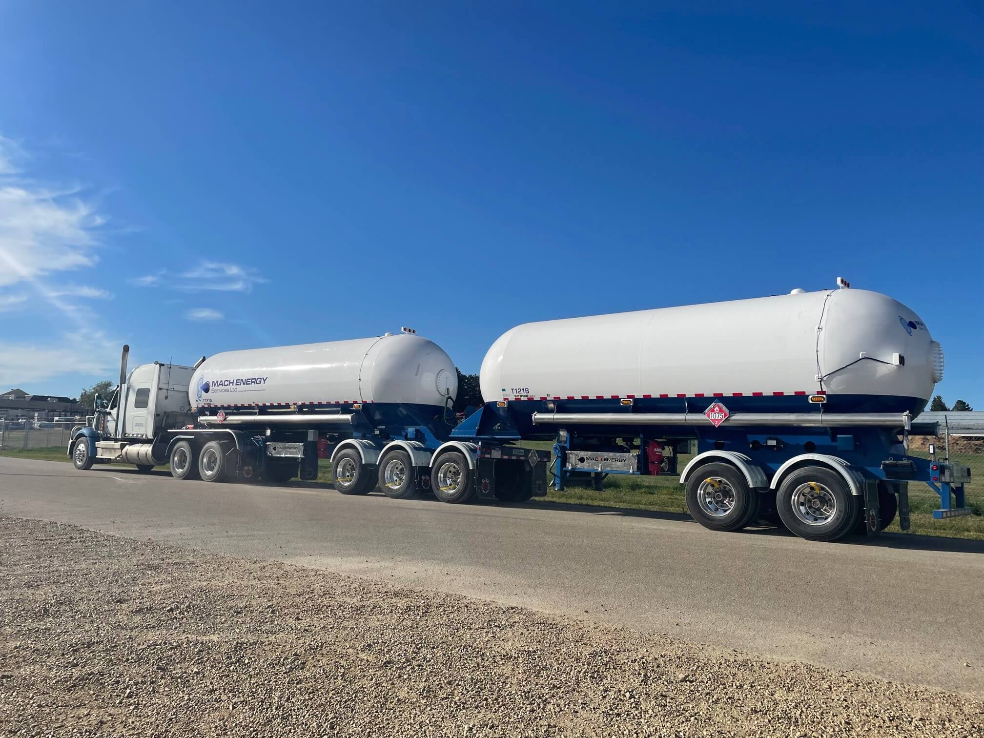 Picture of fuel tanker truck on road painted in white